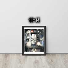 Framed artwork of the front of a graffiti marked up subway train on a white wall with '11x14' text.