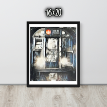 Framed artwork of the front of a graffiti marked up subway train on a white wall with '16x20' text.