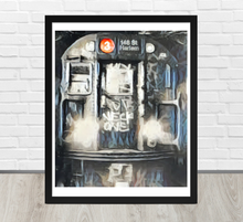 Framed artwork of the front of a subway car with graffiti on a white brick wall background