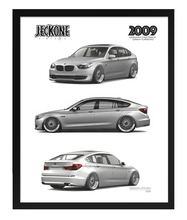 A framed automotive art print featuring three views of a silver 2009 BMW Gran Coupe, with the brand name 'JECKONE' and model details printed on a white background inside a black frame.